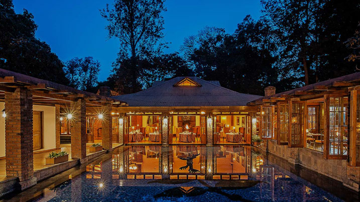 Safari lodge courtyard illuminated in the evening